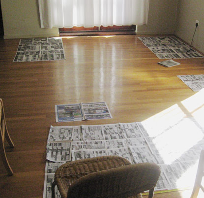 Paper prototyping a lounge/dining space with newspaper