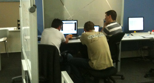 A group of developers watching usability testing video